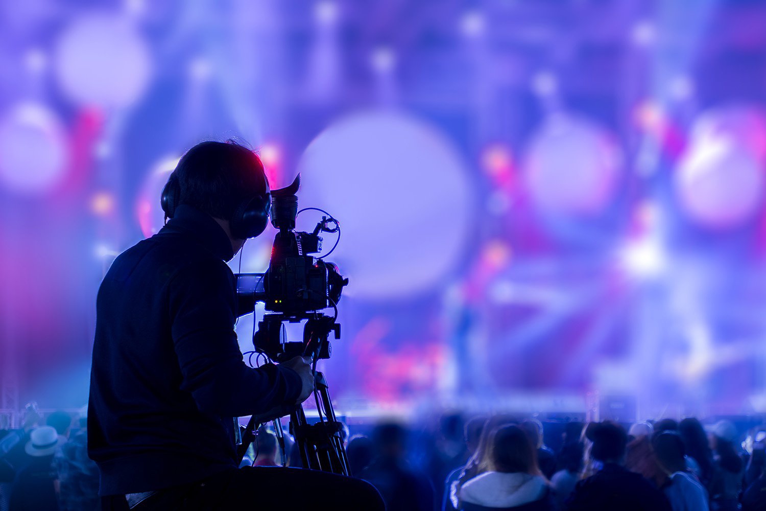 Camera man shooting a crowd at an event